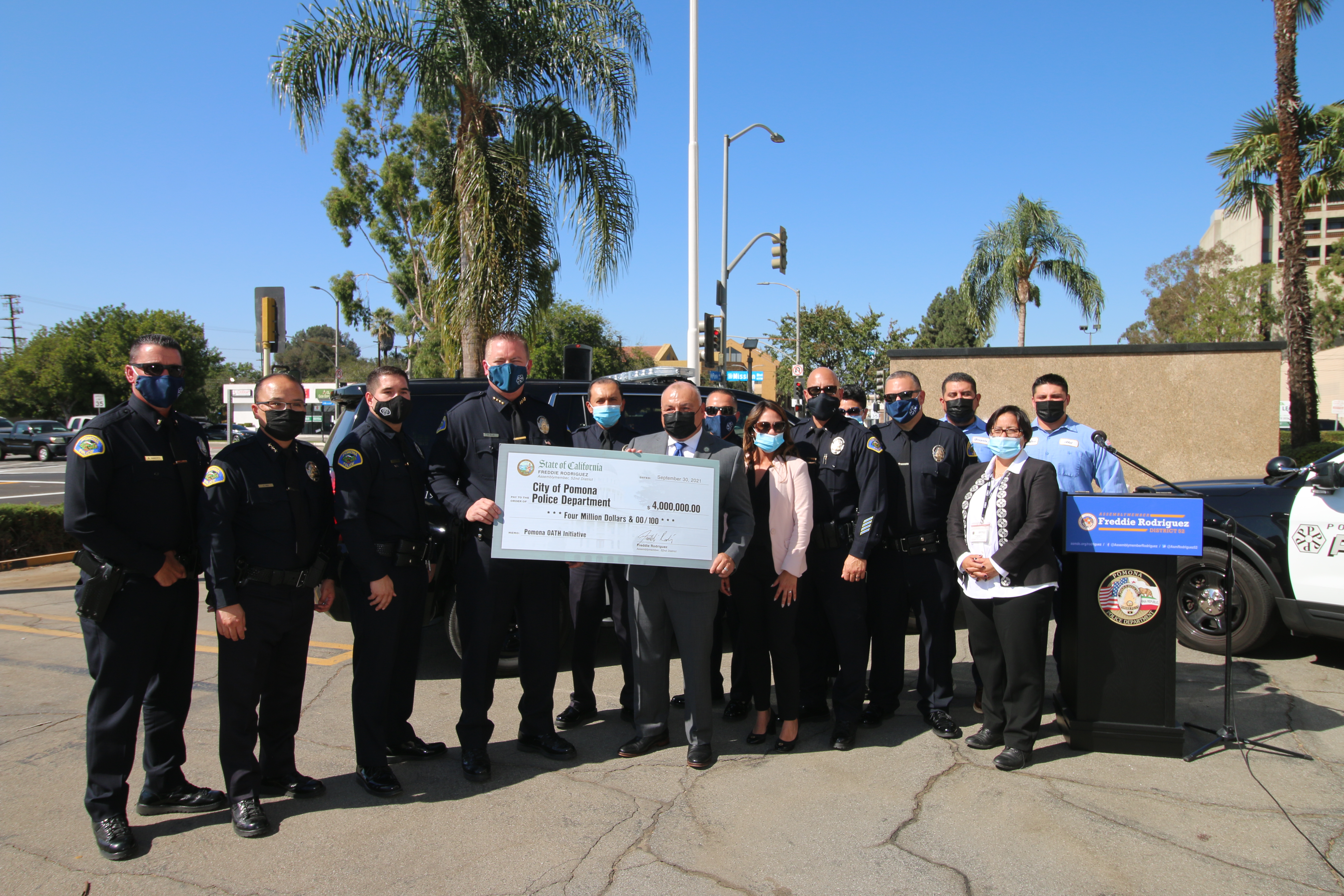 Group stands with check for the Pomona OATH Initiative funding, secured by Assemblymember Rodriguez in the 2021-22 State Budget