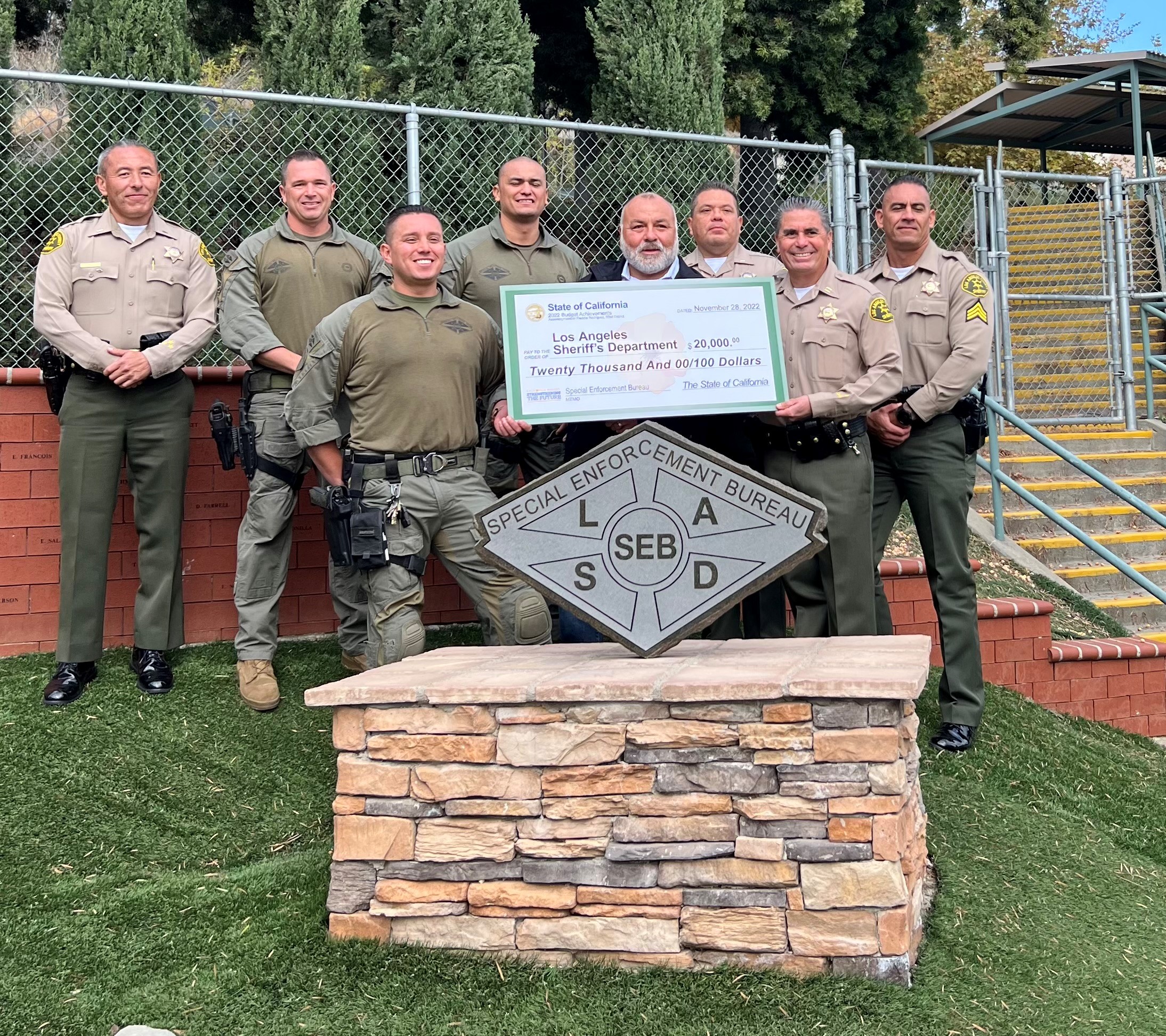 Assemblymember Freddie Rodriguez (D – Pomona) presents a check to the Los Angeles County Sheriff’s Department 