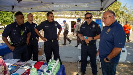 Assemblymember Rodriguez speaking to a group of police officers at the 6th Annual Women's Health Fair