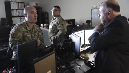 Asm. Rodriguez tours the emergency operations center and received briefing from National Guard member. 