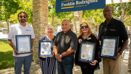 Rodriguez poses with event honorees